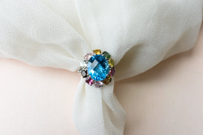 Swiss blue topaz ring with multicolor tourmaline halo in 925 silver