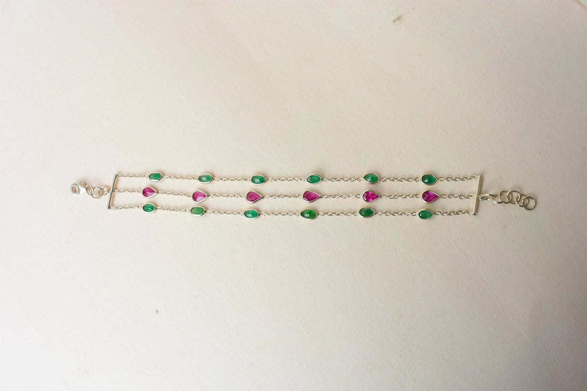 Multi gemstone three-strand bracelet in silver with pink and green stones
