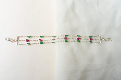 Multi gemstone three-strand bracelet in silver with pink and green stones