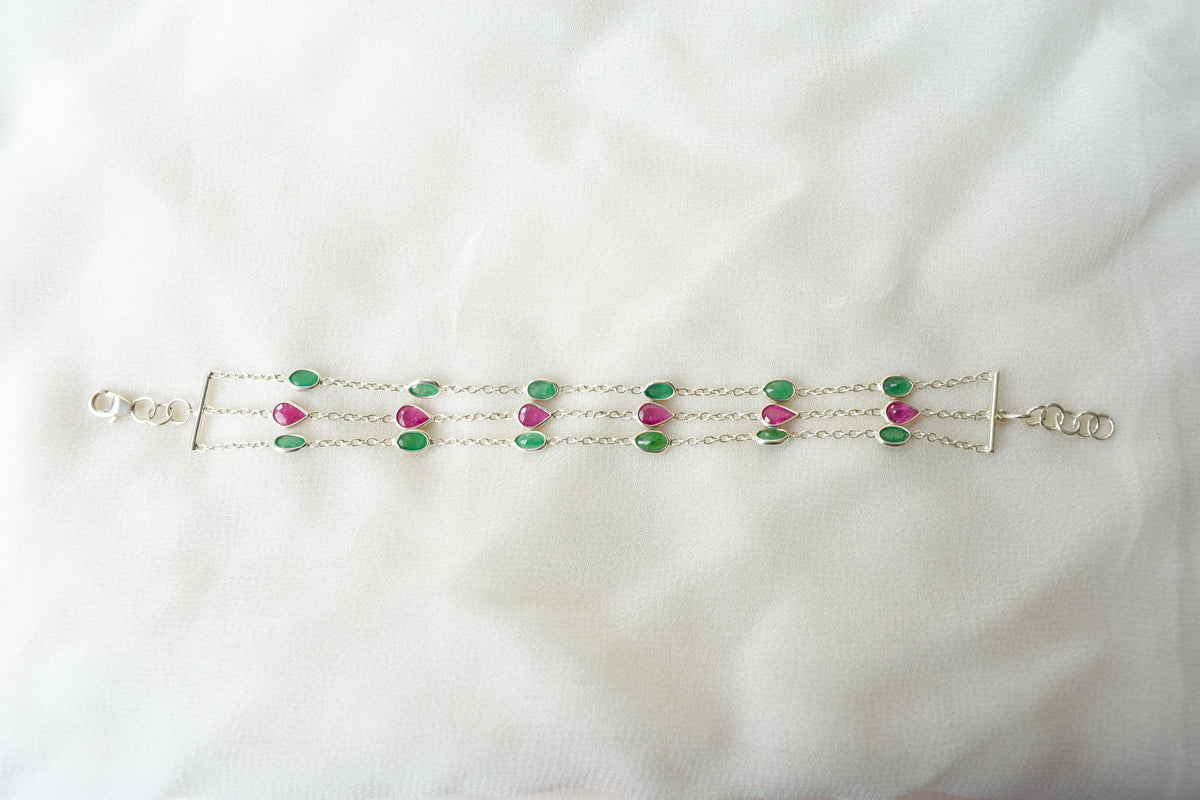 Multi gemstone three-strand bracelet in silver with pink and green stones