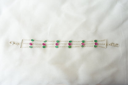 Multi gemstone three-strand bracelet in silver with pink and green stones