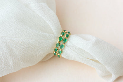 Pear-cut emerald lattice eternity ring in 18K gold with bezel setting