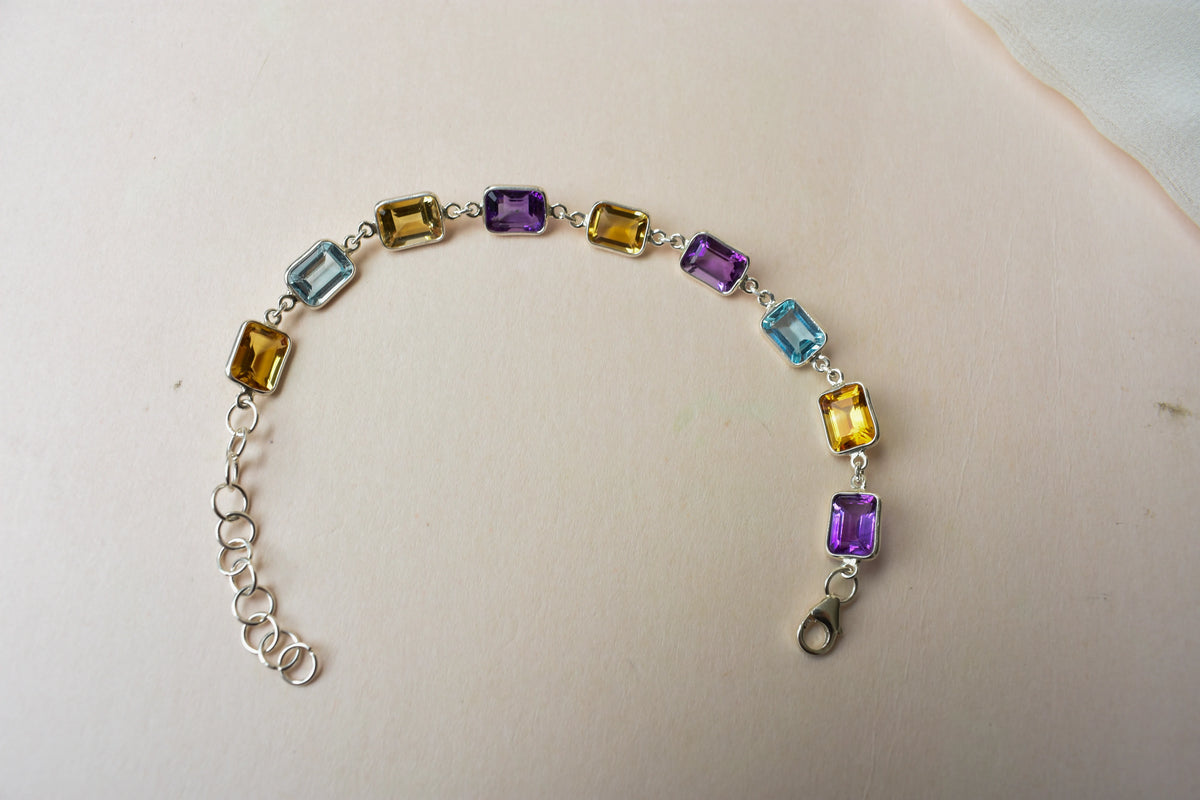 Citrine, amethyst, and blue topaz emerald-cut bracelet in 925 silver