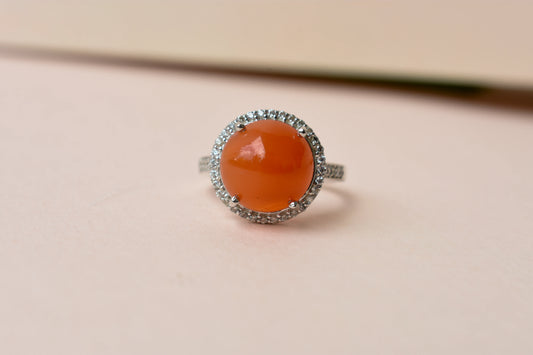 Round carnelian cabochon ring with cubic zirconia halo in 925 silver