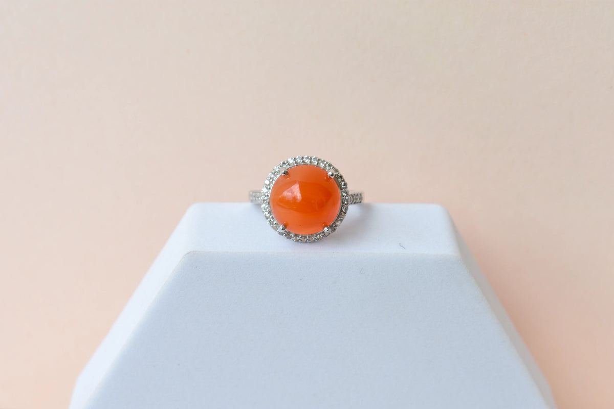 Round carnelian cabochon ring with cubic zirconia halo in 925 silver