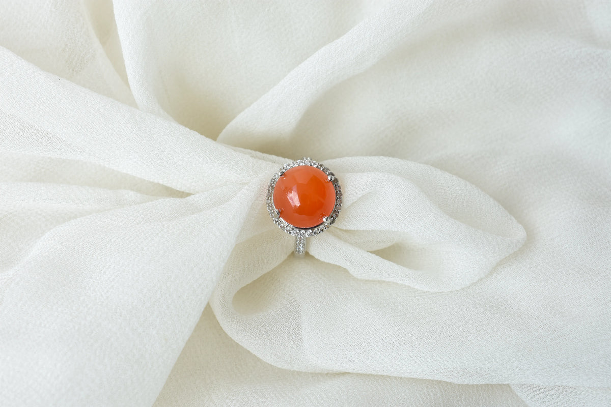 Round carnelian cabochon ring with cubic zirconia halo in 925 silver