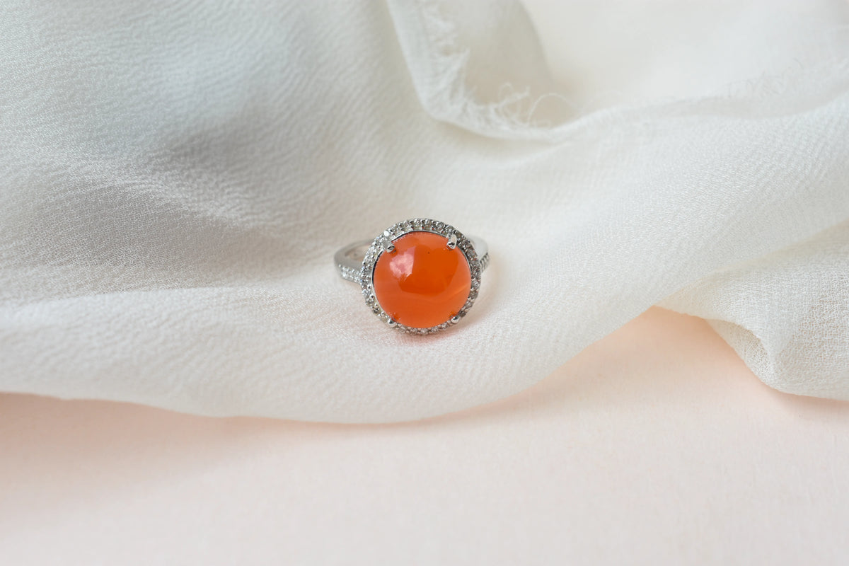 Round carnelian cabochon ring with cubic zirconia halo in 925 silver