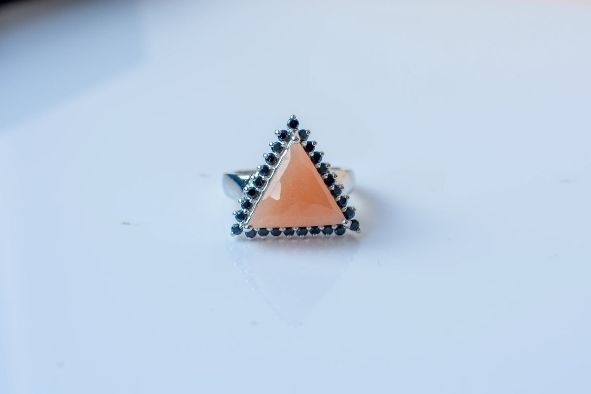 Triangular sunstone ring with black spinel halo in 925 silver