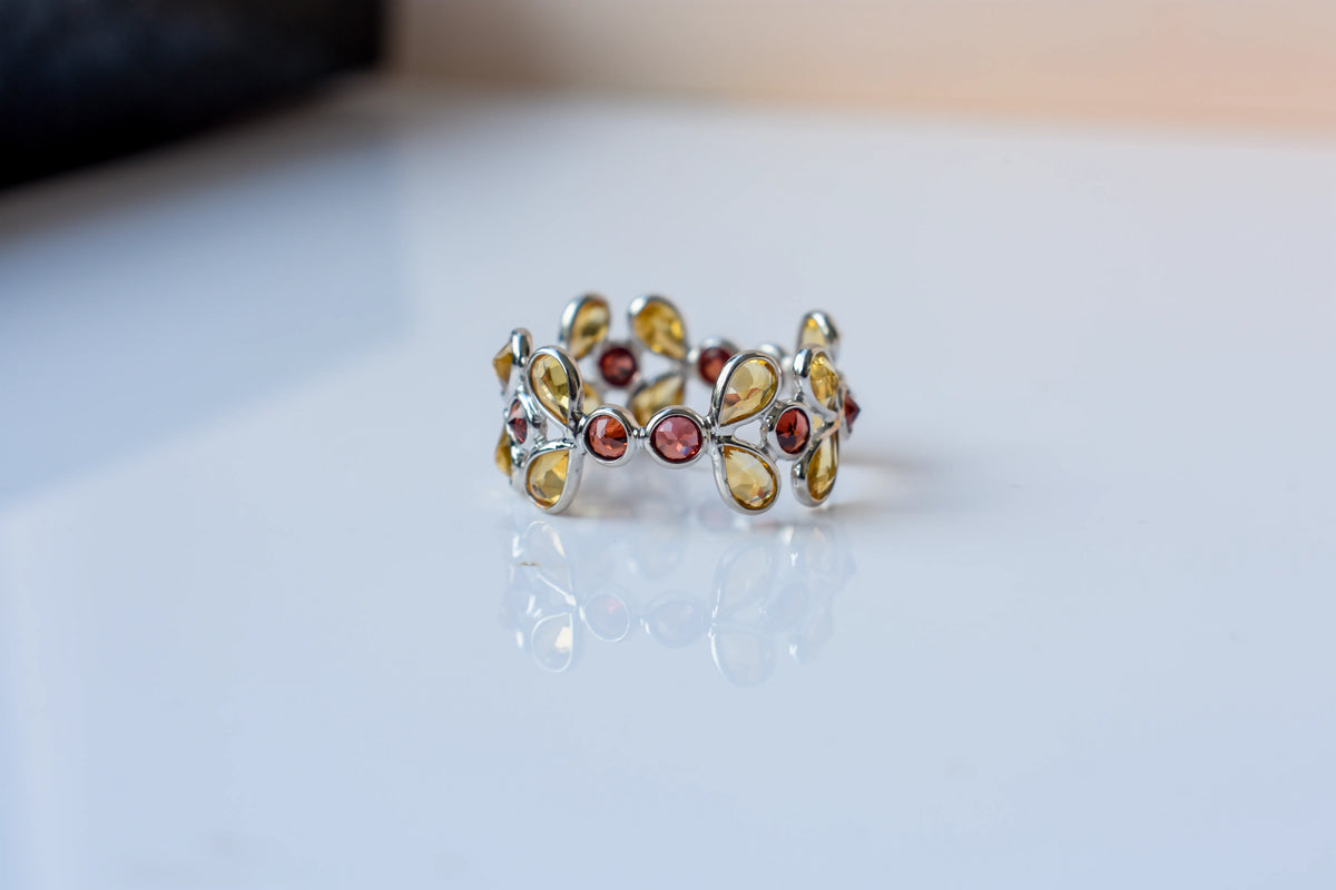 Citrine and garnet flower link eternity band in 925 silver