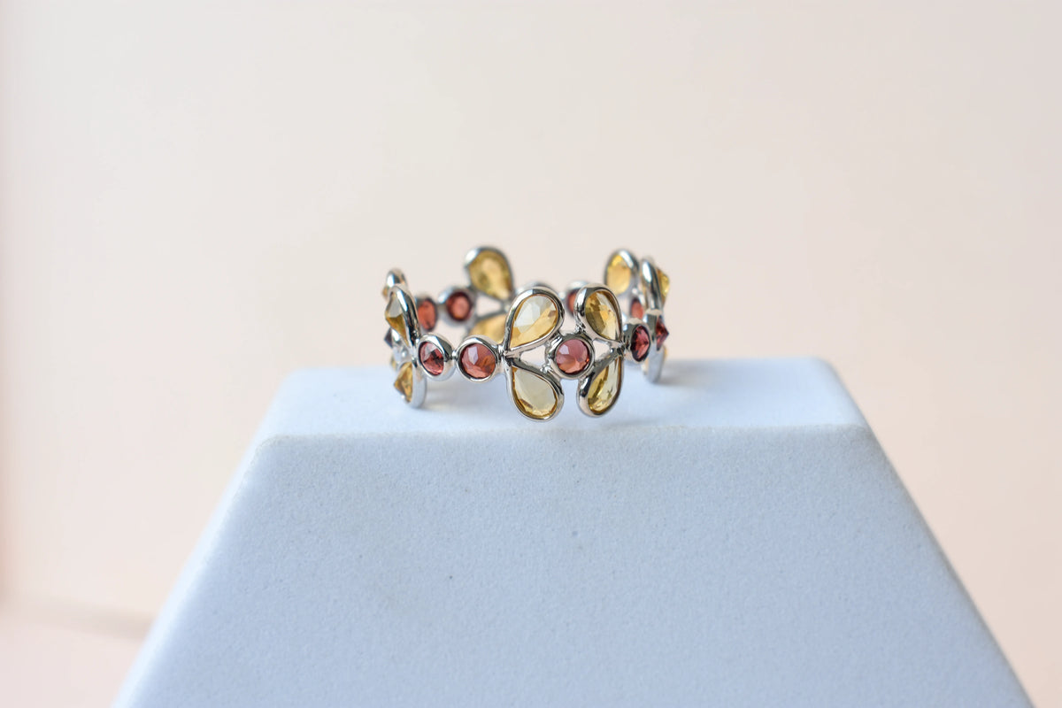 Citrine and garnet flower link eternity band in 925 silver