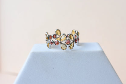 Citrine and garnet flower link eternity band in 925 silver