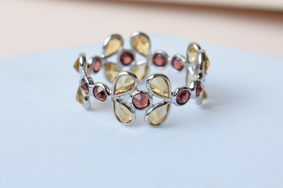 Citrine and garnet flower link eternity band in 925 silver