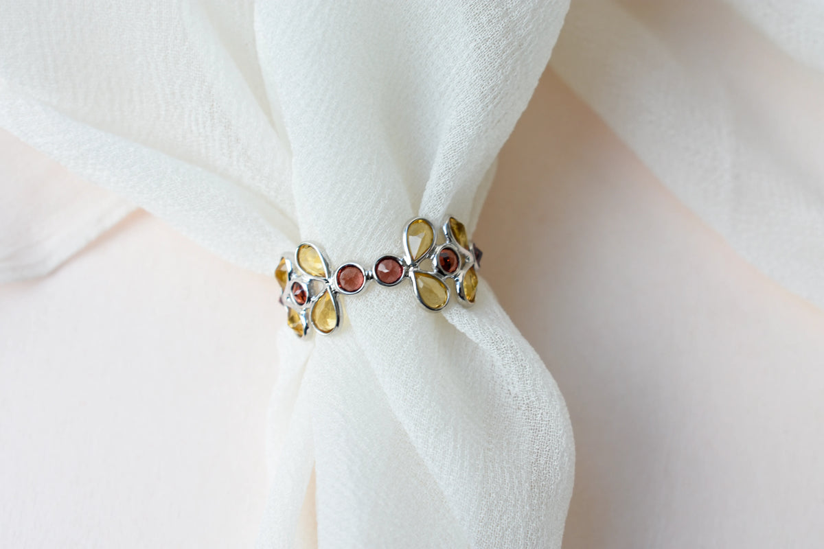 Citrine and garnet flower link eternity band in 925 silver