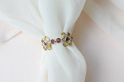 Citrine and garnet flower link eternity band in 925 silver