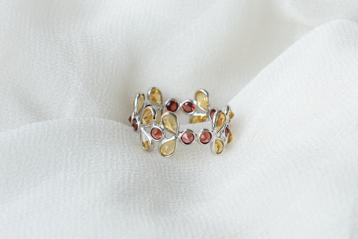 Citrine and garnet flower link eternity band in 925 silver
