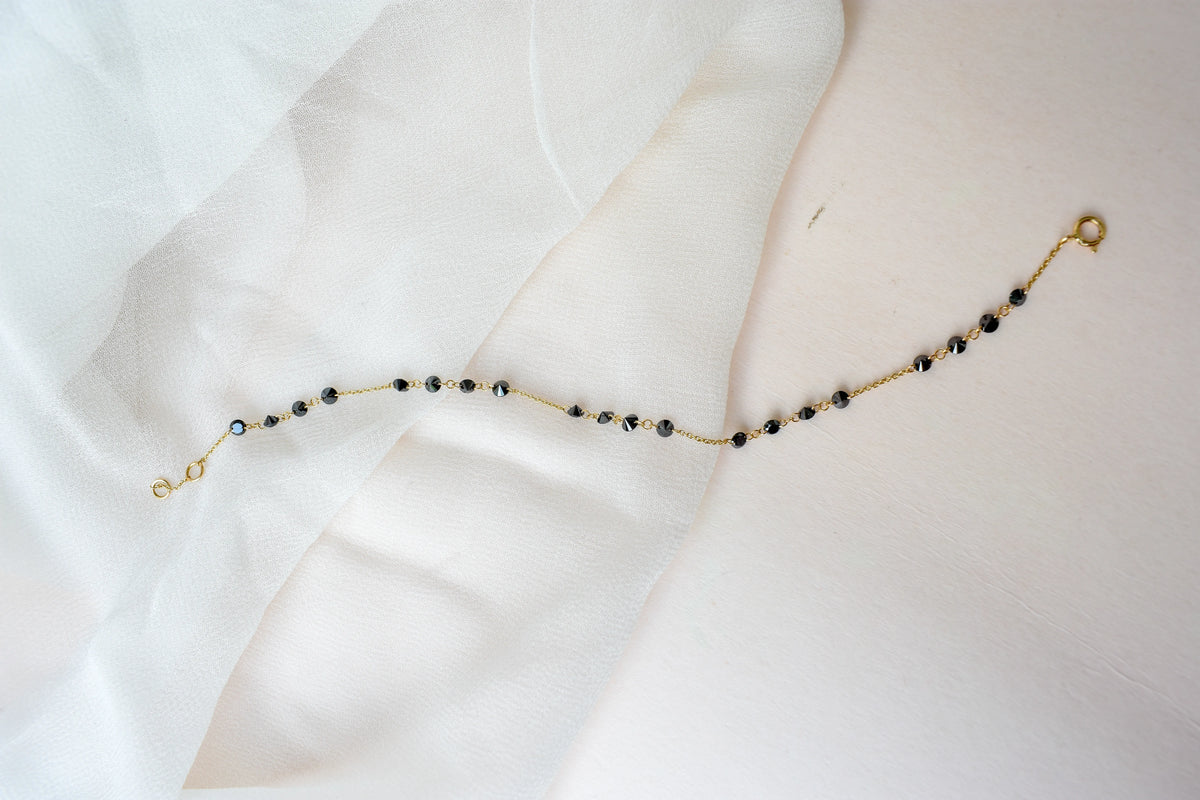 18K gold bracelet with clustered black diamond beads
