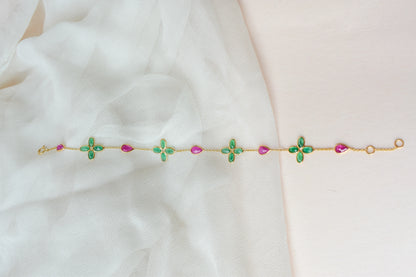 18K gold bracelet with emerald quatrefoil clusters and ruby drops