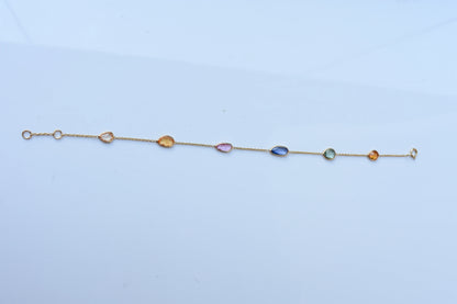 18K gold bracelet with organic-cut multi-coloured sapphire stations