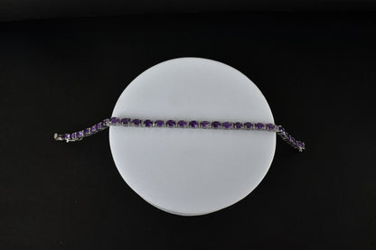 Oval-cut amethyst tennis bracelet with cubic zirconia accents in 925 silver