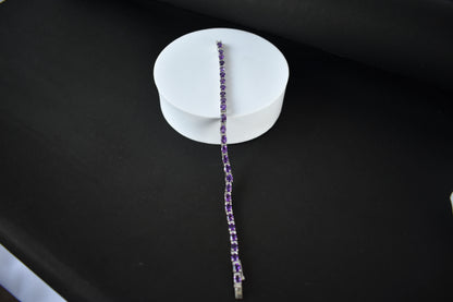 Oval-cut amethyst tennis bracelet with cubic zirconia accents in 925 silver
