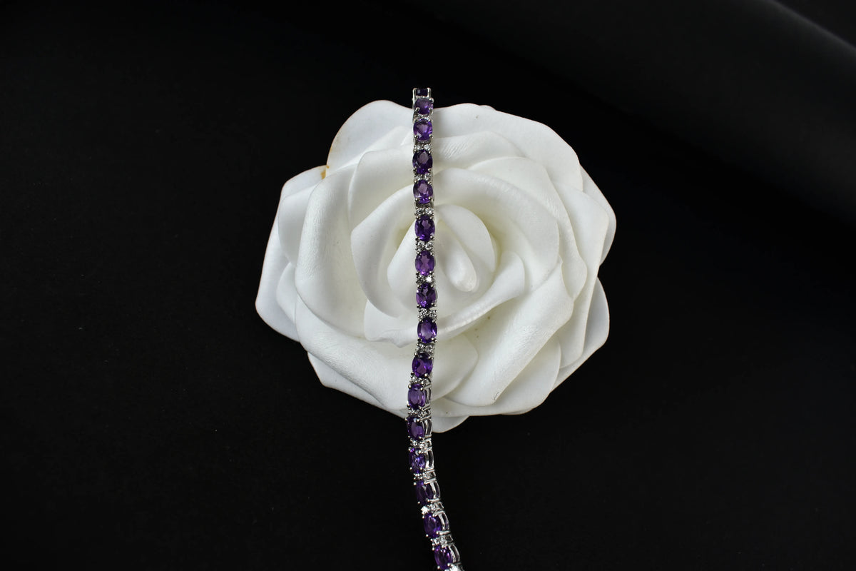Oval-cut amethyst tennis bracelet with cubic zirconia accents in 925 silver