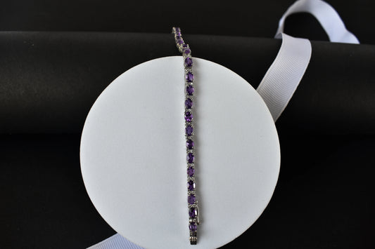 Oval-cut amethyst tennis bracelet with cubic zirconia accents in 925 silver