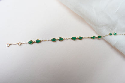 18K gold bracelet with pear-cut emerald drops