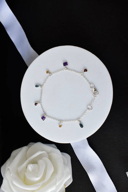 Multi gemstone charm bracelet with mixed-cut colored stones on a 925 silver chain