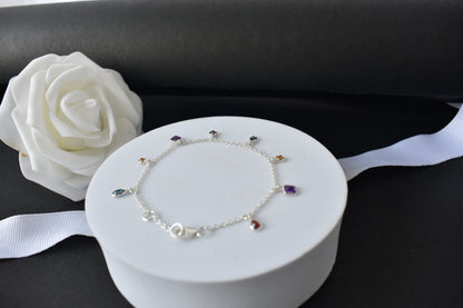 Multi gemstone charm bracelet with mixed-cut colored stones on a 925 silver chain