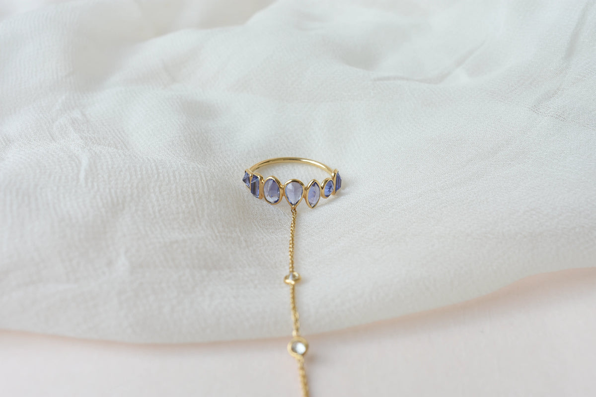 18K gold hand chain with tanzanite ring and diamond wrist accents