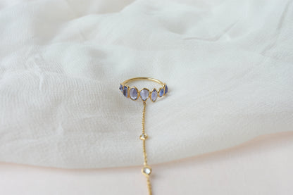 18K gold hand chain with tanzanite ring and diamond wrist accents