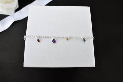 Multi gemstone charm bracelet with mixed-cut colored stones on a 925 silver chain
