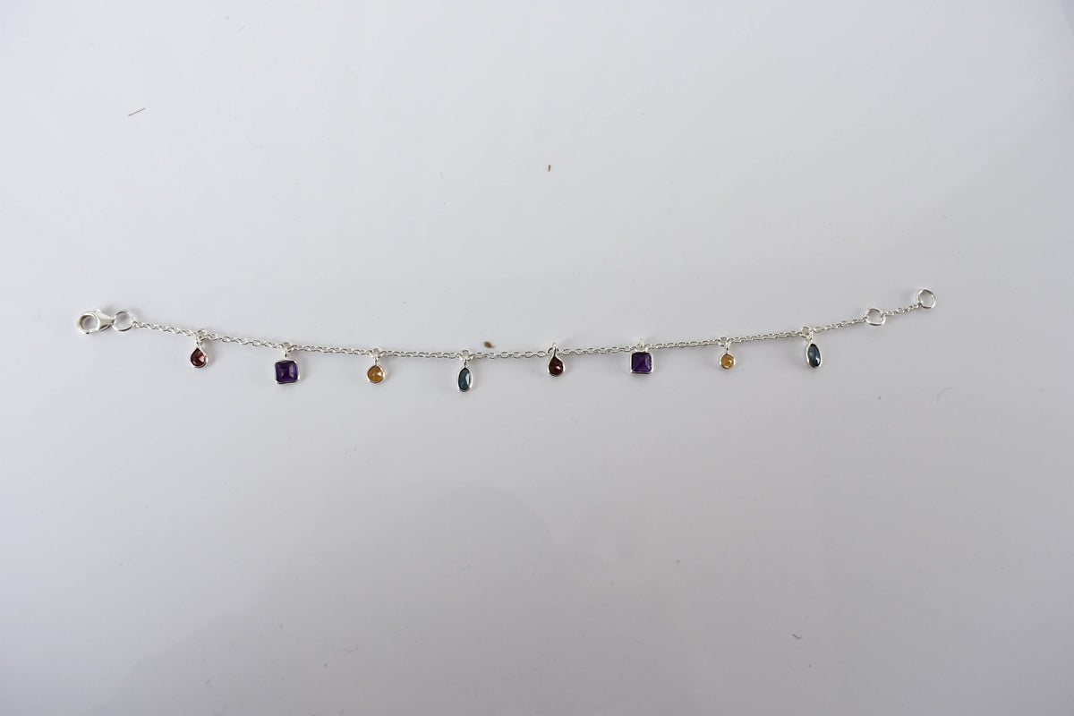 Multi gemstone charm bracelet with mixed-cut colored stones on a 925 silver chain