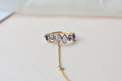 18K gold hand chain with tanzanite ring and diamond wrist accents