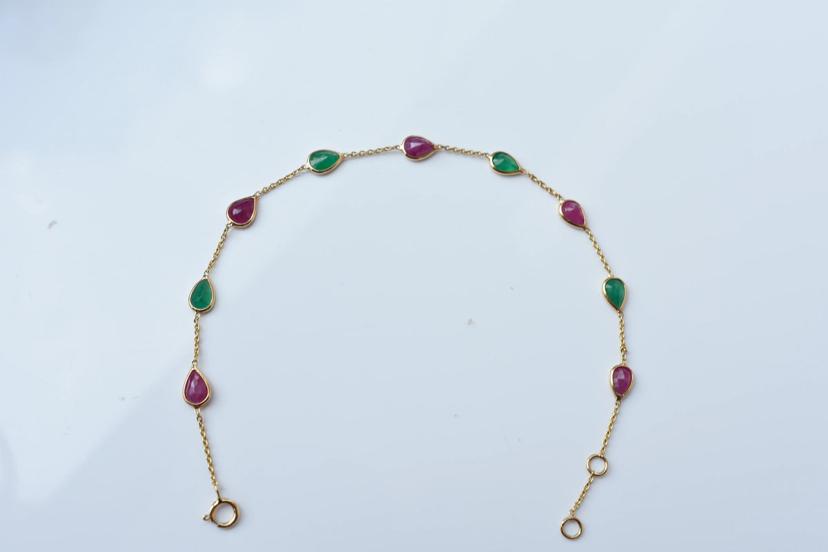 18K gold bracelet with alternating ruby and emerald drops
