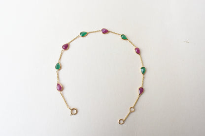 18K gold bracelet with alternating ruby and emerald drops