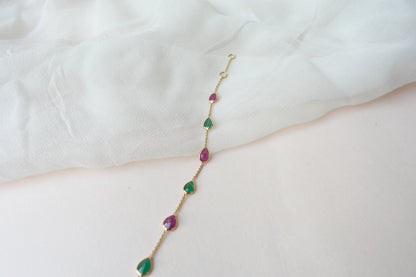 18K gold bracelet with alternating ruby and emerald drops