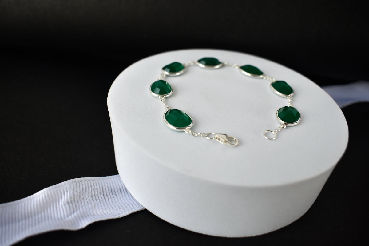 Faceted green onyx bracelet with bezel-set stones in 925 silver