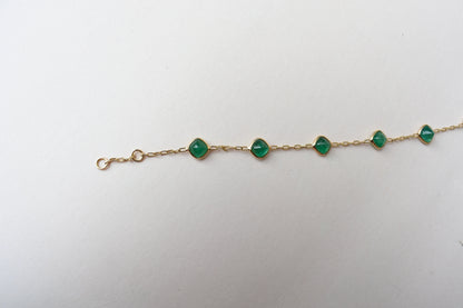 18K gold bracelet with cabochon-cut emerald stations