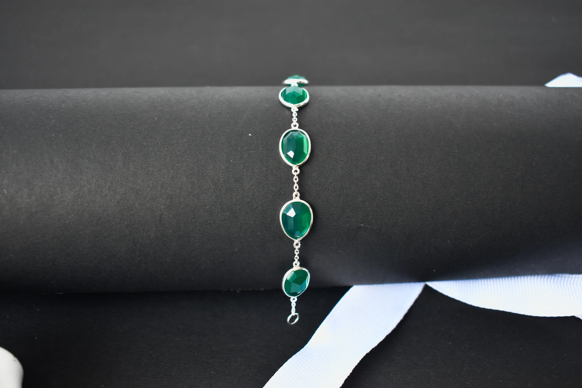 Faceted green onyx bracelet with bezel-set stones in 925 silver