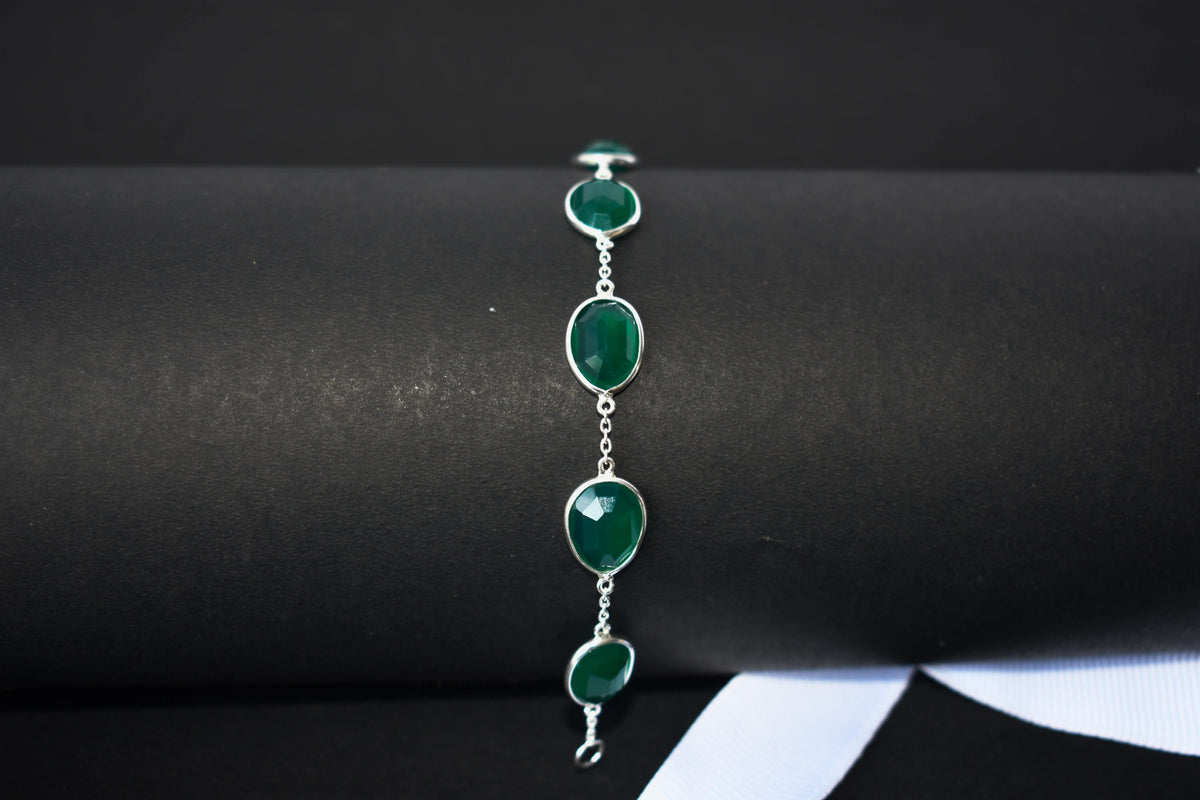 Faceted green onyx bracelet with bezel-set stones in 925 silver