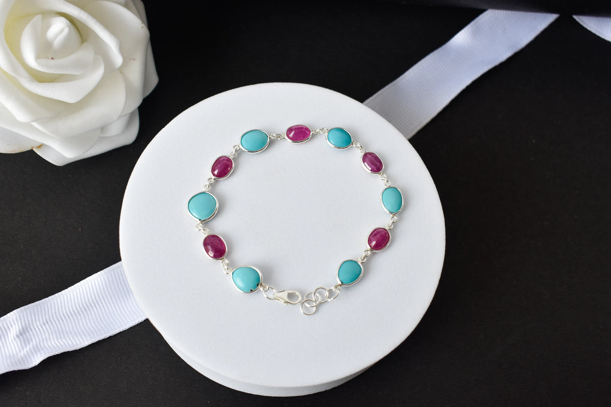 Ruby and turquoise cabochon bracelet with bezel-set stones in 925 silver
