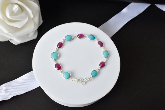 Ruby and turquoise cabochon bracelet with bezel-set stones in 925 silver