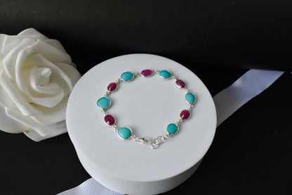 Ruby and turquoise cabochon bracelet with bezel-set stones in 925 silver