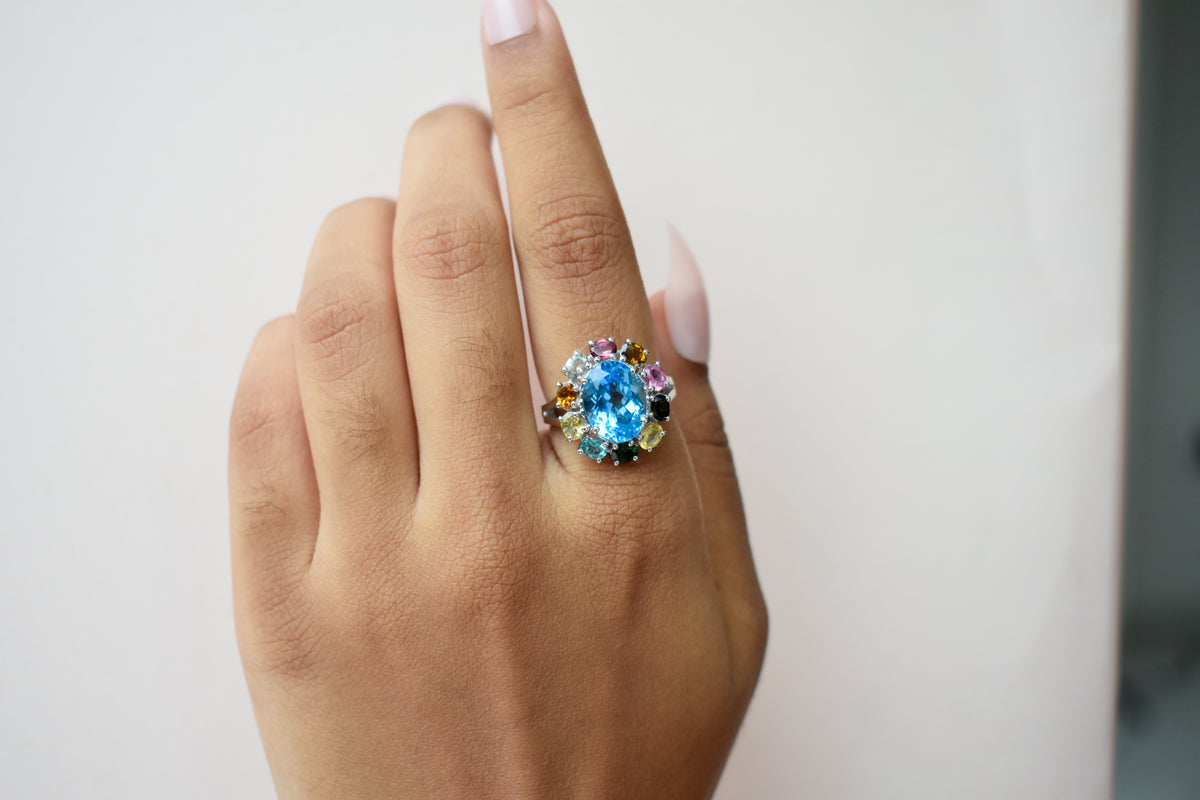 Swiss blue topaz ring with multicolor tourmaline halo in 925 silver