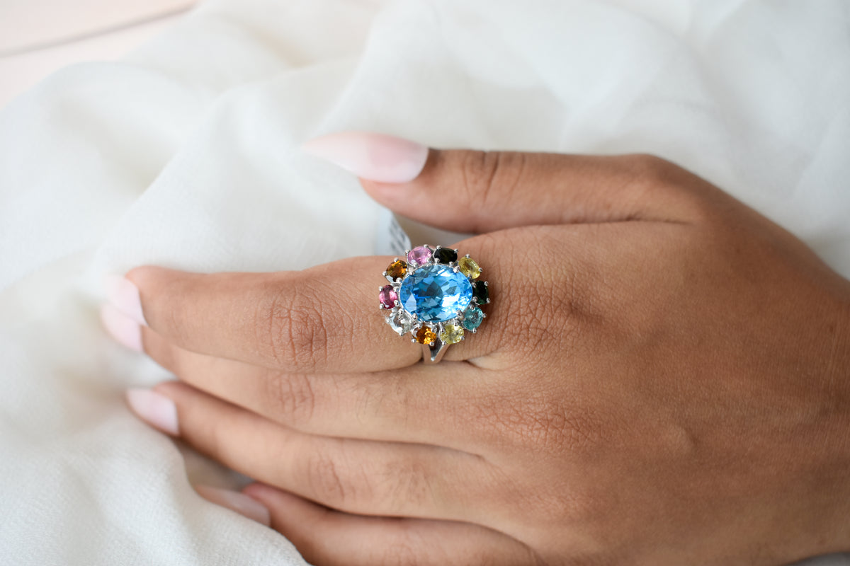 Swiss blue topaz ring with multicolor tourmaline halo in 925 silver
