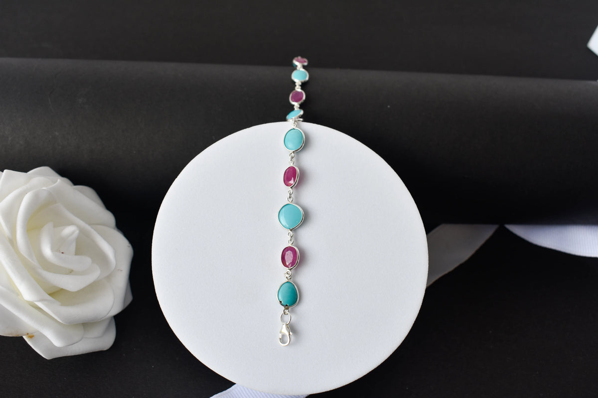 Ruby and turquoise cabochon bracelet with bezel-set stones in 925 silver