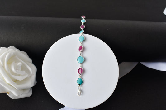 Ruby and turquoise cabochon bracelet with bezel-set stones in 925 silver