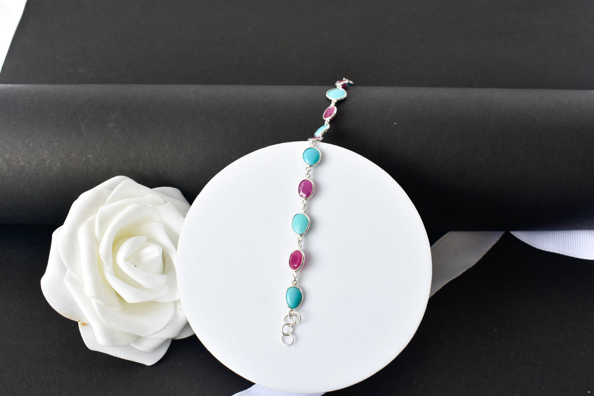 Ruby and turquoise cabochon bracelet with bezel-set stones in 925 silver