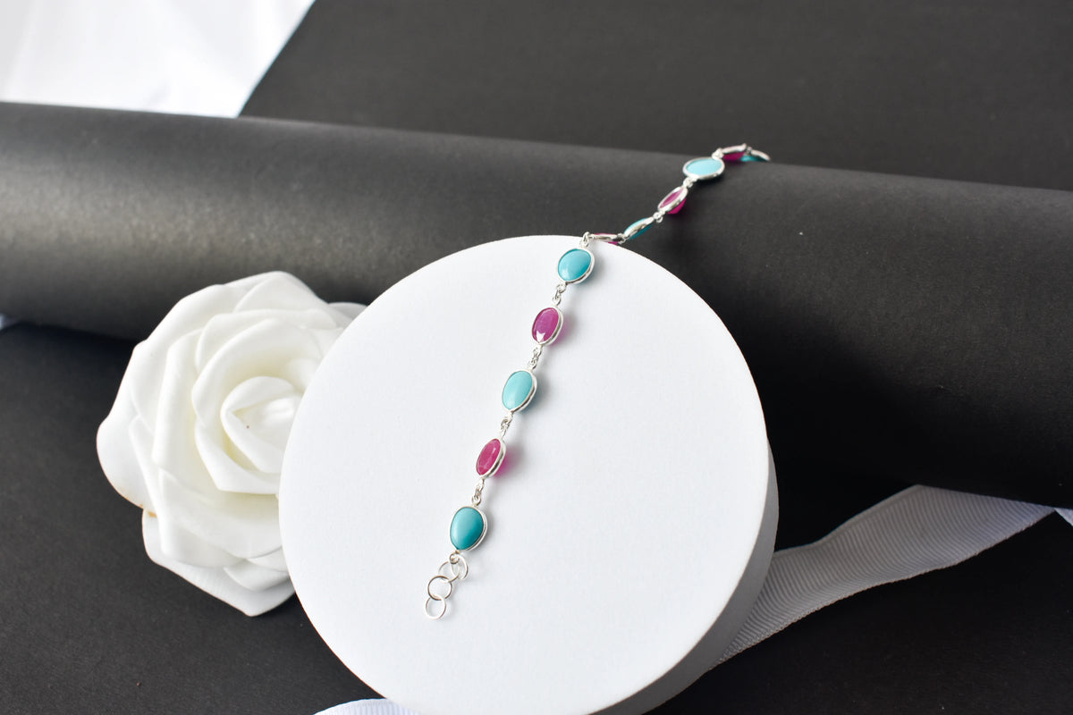 Ruby and turquoise cabochon bracelet with bezel-set stones in 925 silver